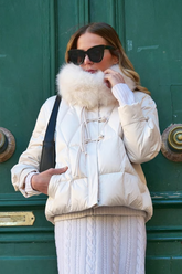 a lady wears a white puffer jacket